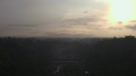 Aerial-view-of-Watu-Purbo-Waterfall-or-"Grojogan-Watu-Purbo"-in-sunrise-time