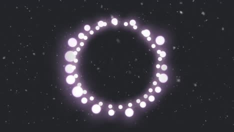 Animation-of-circle-of-glowing-round-pink-christmas-fairy-lights-over-falling-snow,-on-black