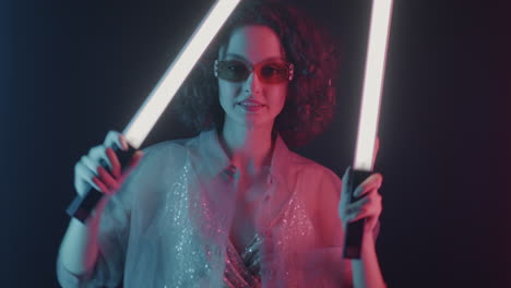 Woman with Neon Lightsabers