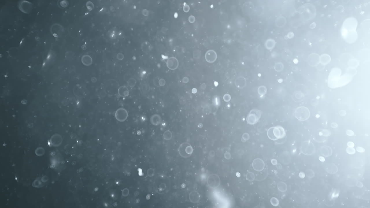боке из плавающих абстрактных частиц на темном фоне