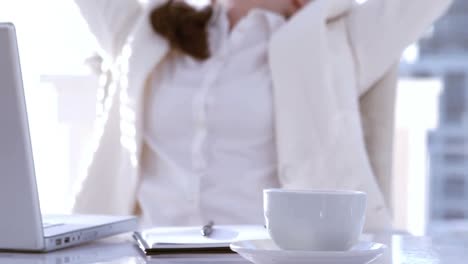 Businesswoman-cheering-at-her-desk