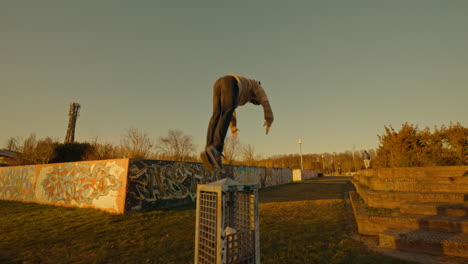parkour in urban park at sunset