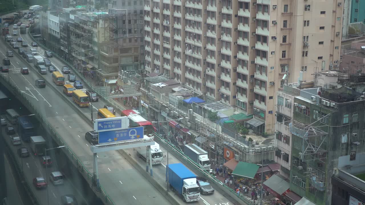 Slow Moving Traffic On Canal Road Flyover In Causeway Bay, Hong Kong. high angle