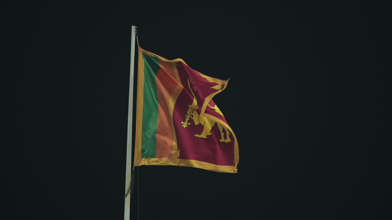The Sri Lankan flag waving proudly in the night breeze