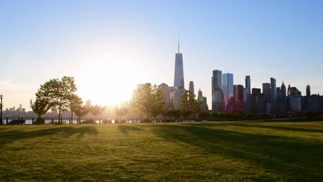 liberty state park nj with manhattan skyline in silhouette, stunning sunrise, travel tourist destination.