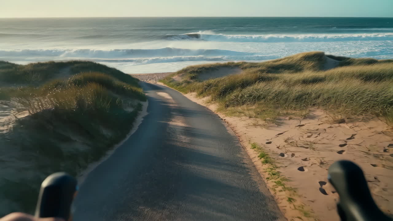 Cycling Path to a Wavy Beach at Sunset