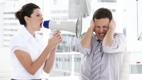 competitive woman shouting through a megaphone