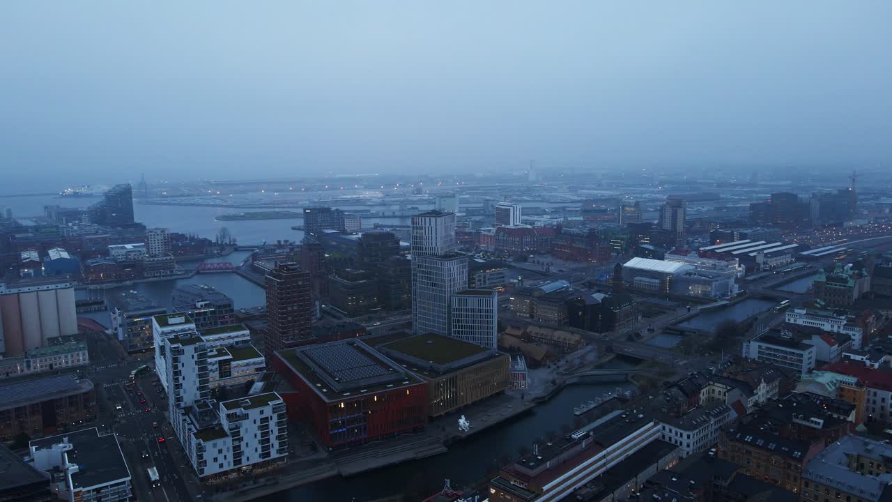 Beautiful aerial of high rise buildings in the modern part of Malmö, Sweden on a fog covered morning