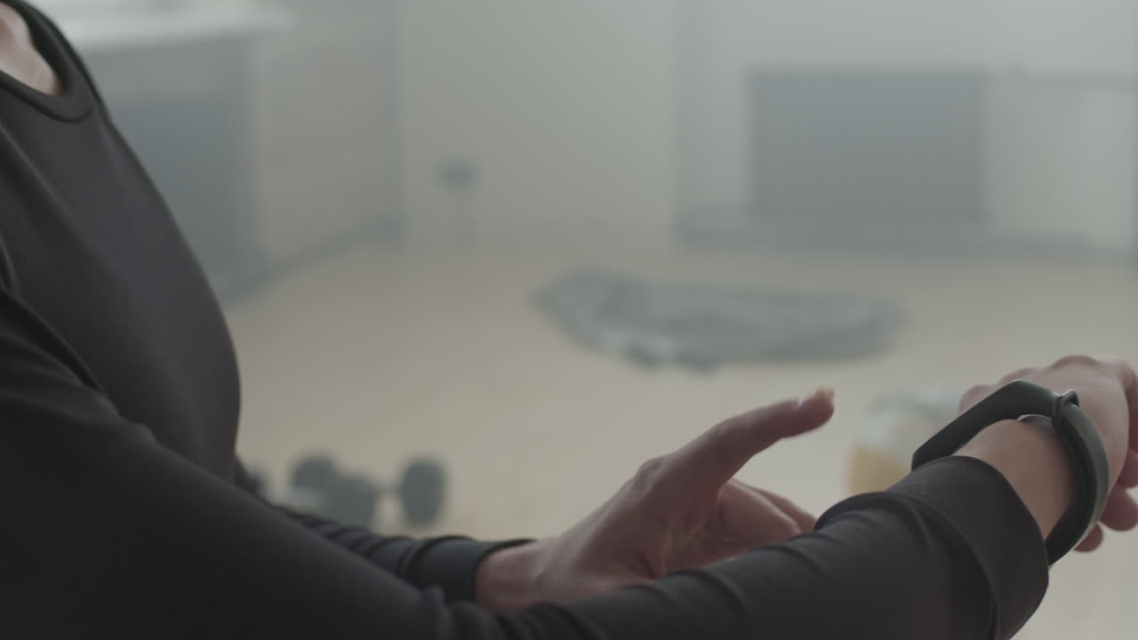 Sportsman Using Smart Watch During Workout