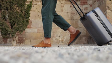 man walking with suitcase
