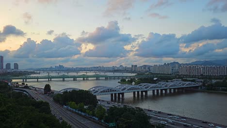 seoul, hangang bridge over han river, and green railway bridge at sunset, traffic on olympic expressway