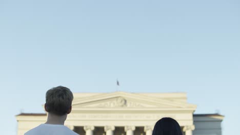 couple in front of a historical building