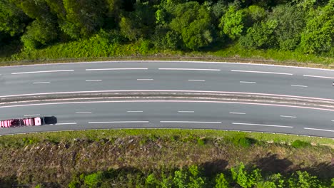 view from above of an asphalt road with dense forest near padron, rois, a coruna, spain