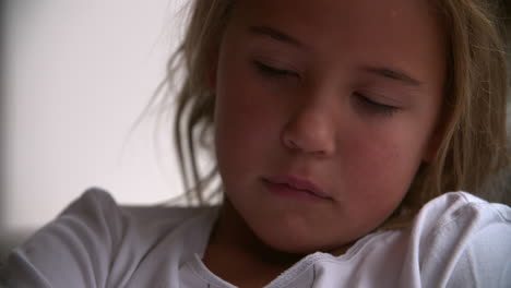 close up portrait of unhappy child looking at camera