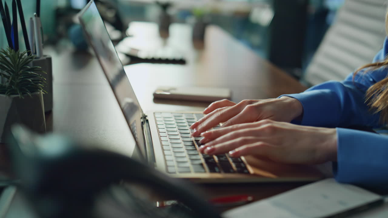 Businesswoman hands typing laptop in office desk closeup. Focused woman working