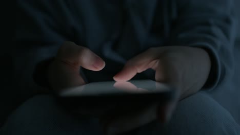 person using a smartphone at night