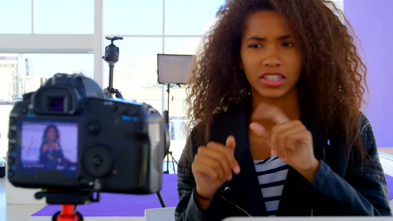 Model recording her video in photo studio 4k