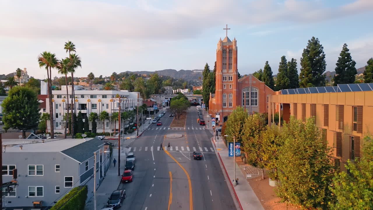 Los Angeles, USA, 29 August 2025: Flight above the Gower Street in Hollywood, Los Angeles, California, USA. Hollywood Hills at backdrop