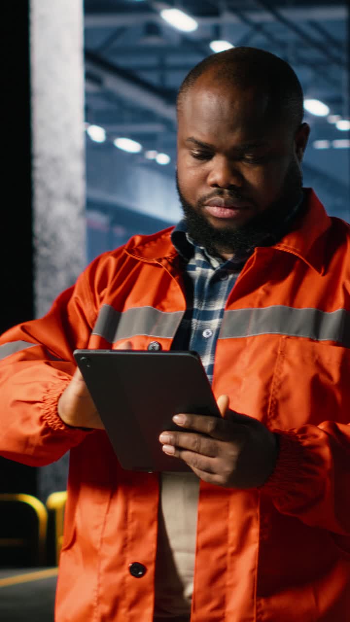 Vertical Video Worker uses technology tools to coordinate construction and fabrication tasks