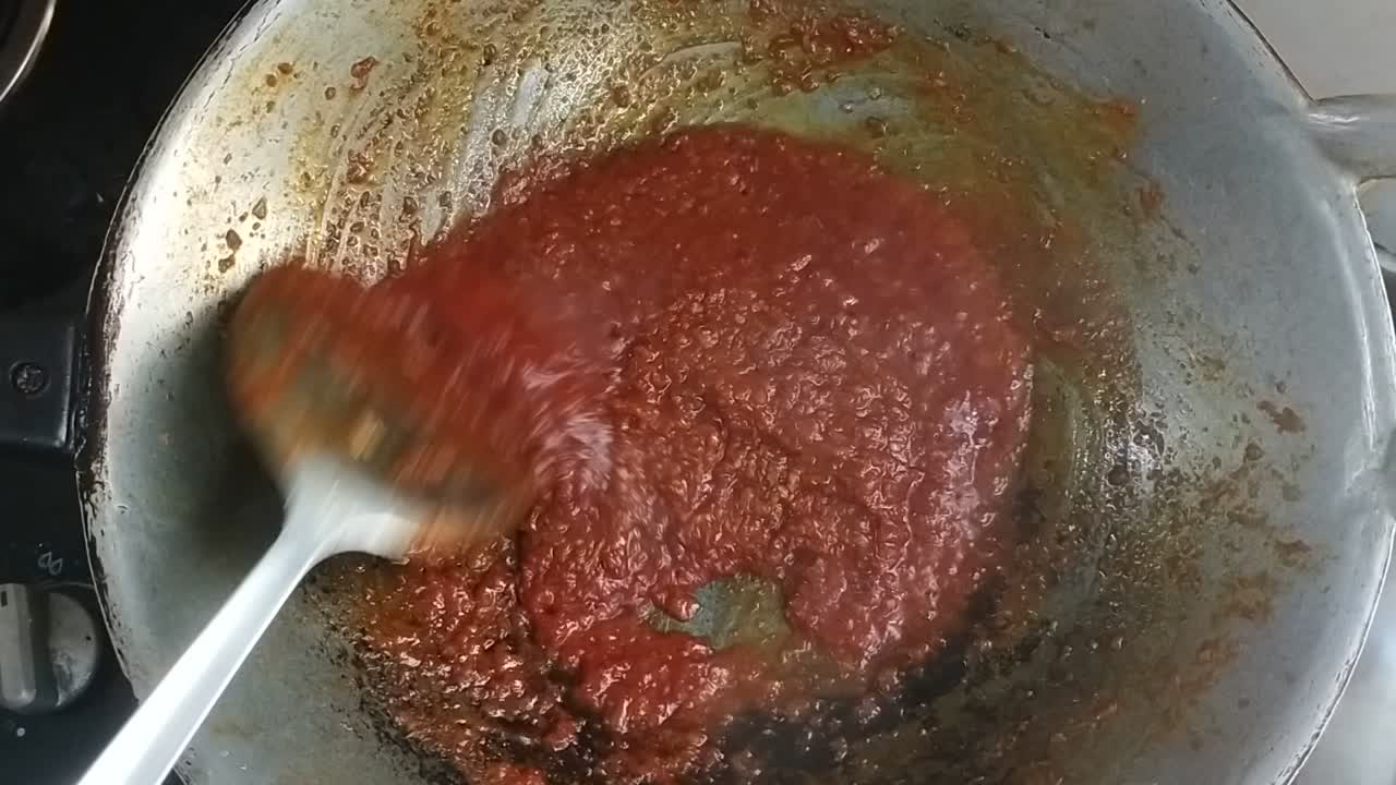 Sambal Tumis or stir-fried chilli paste is a versatile Malay and Indonesian condiment in the hot pan which is used for cooking spicy dishes such as added with prawns, egg and stinky beans.