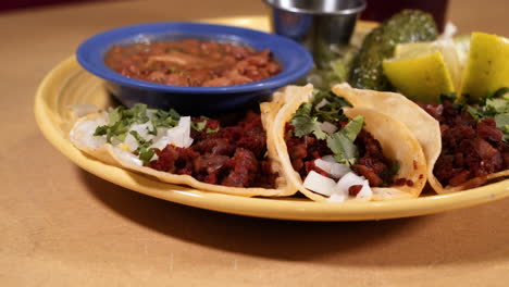 traditional mexican pastor taco plate at restaurant, slider close up hd