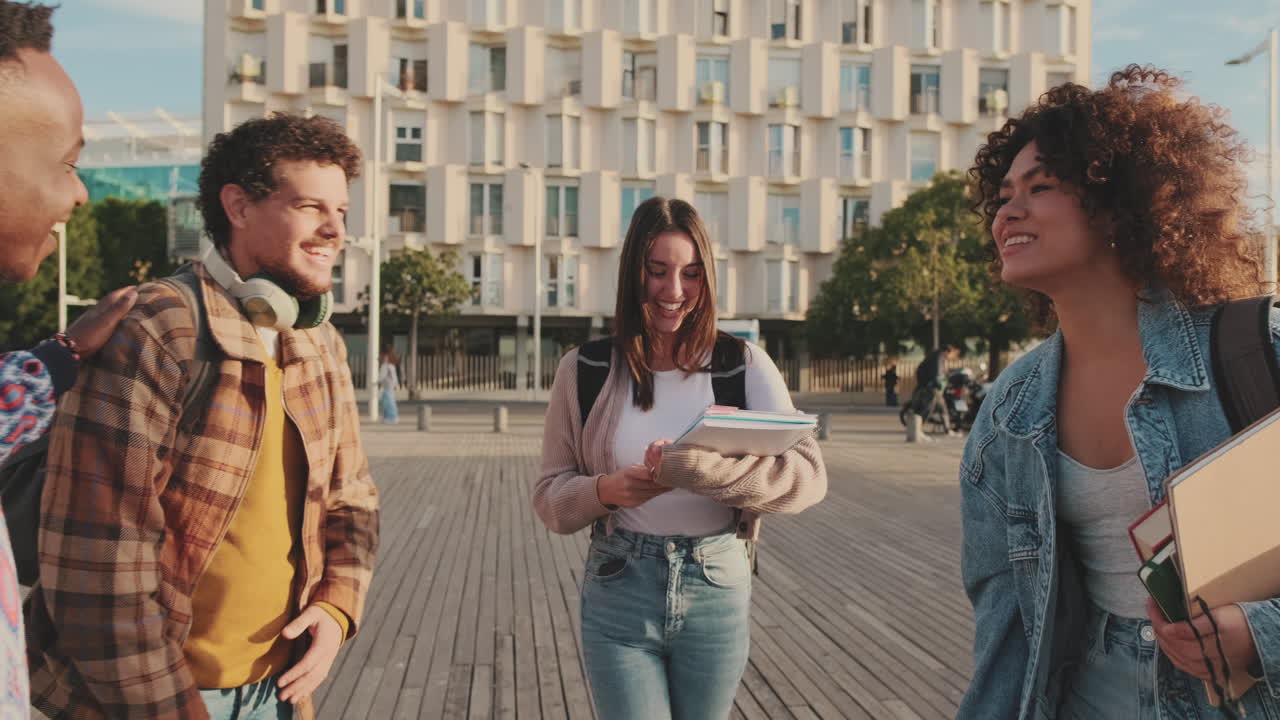 Students meeting and hugging each other in the city