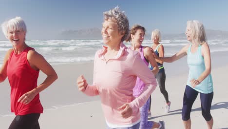 athletic women running on the beach