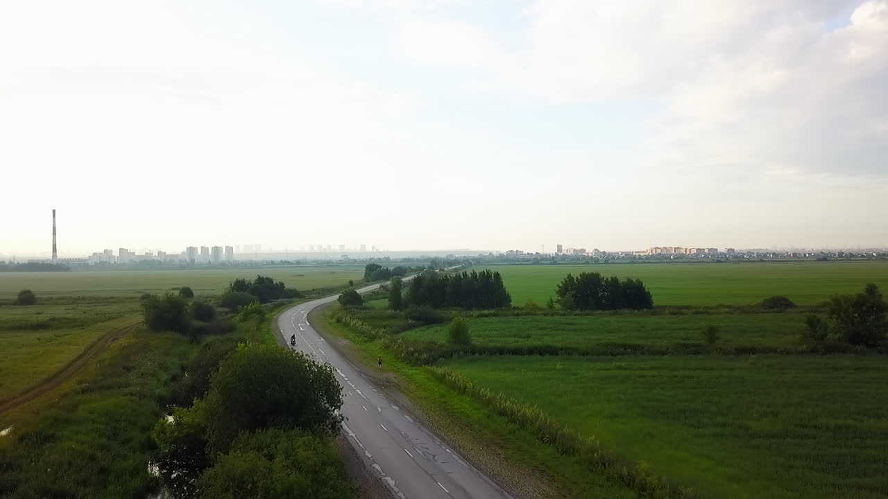 Road through field landscape