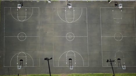 empty laie park basketball courts with shadows, hawaii, aerial birds eye view