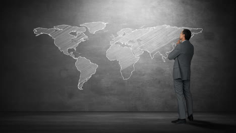 businessman looking at world map