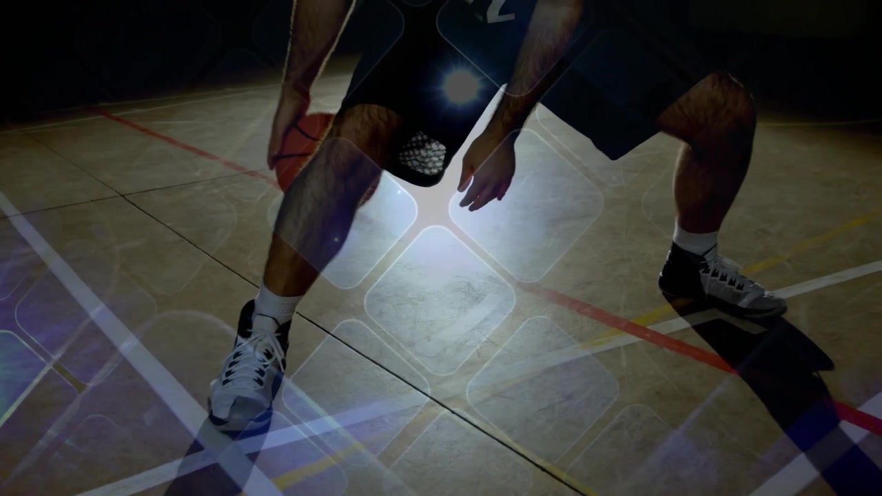 Basketball player starting low dribble doing crossover pivot lens flare showing ball path training