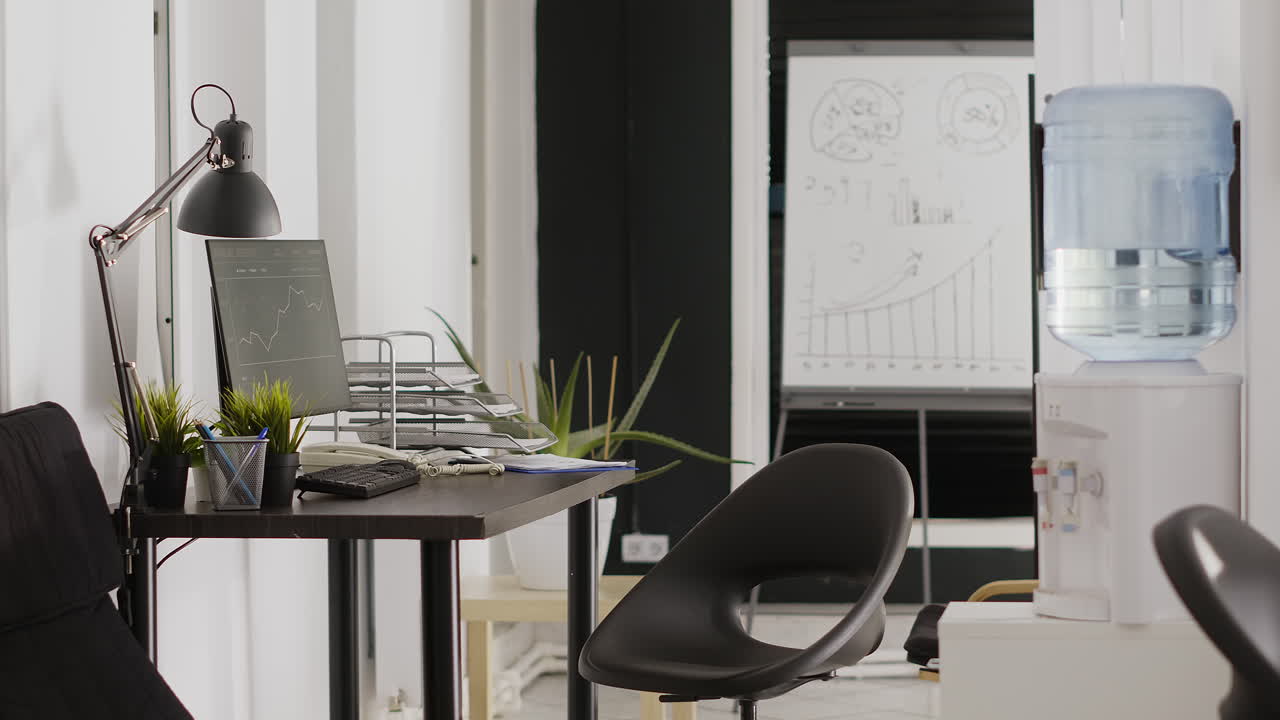 Office workspace with desk, computer, and chair
