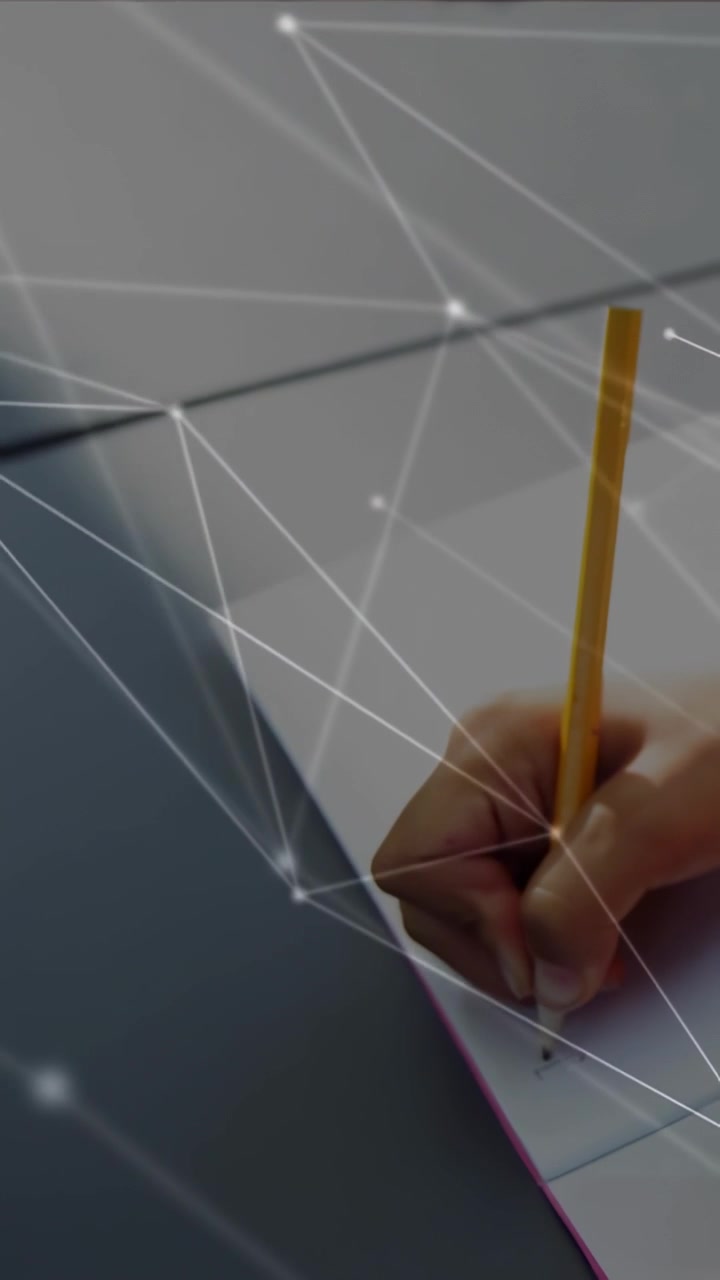 Vertical video: Girl lowering pencil making marks on lined paper for study with net overlay on tip