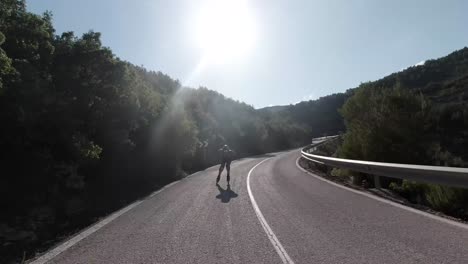 downhill roller skating front facing follow shot