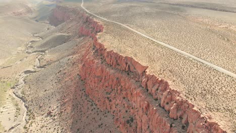 beautiful remote dirt road in the atacama desert near a cliff