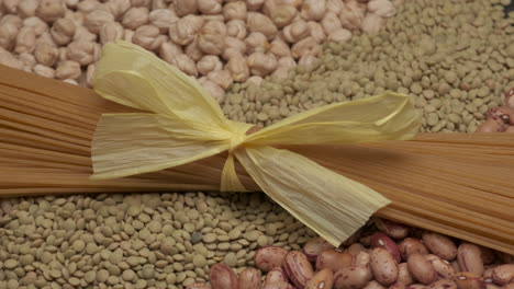 wholemeal spaghetti pasta and dry legumes beans, lentils and chickpeas