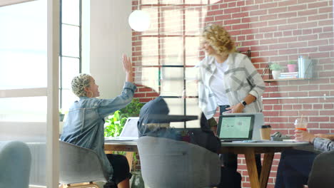 Woman-leader,-high-five-or-success-meeting