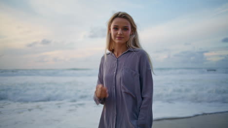 romantic girl ocean sunset alone. closeup smiling travel woman looking camera