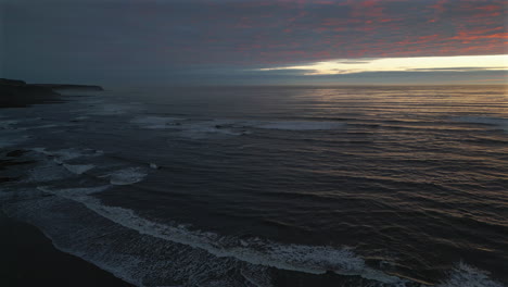 Establishing-Drone-Shot-of-Scarborough-Cliffs-and-Sea-at-Sunrise-with-Mist