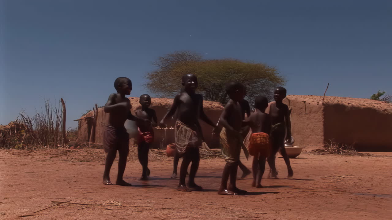 Children playing with water in a rural African village
