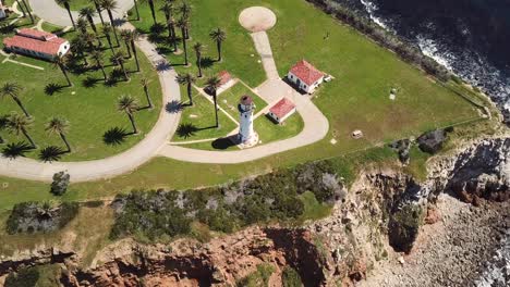 Aerial-View-of-Point-Vicente-Lighthouse-in-Palos-Verdes,-Los-Angeles,-California-with-the-Pacific-Ocean-and-Crystal-Clear-Water-Overlooking-the-Cliffs