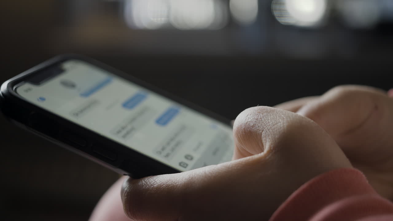 Close-up of hands using a smartphone