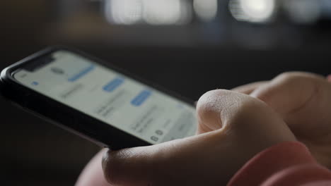 close-up of hands using a smartphone
