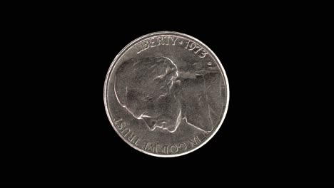 united states 1973 5 cent coin obverse with thomas jefferson first portrait rotating on black background