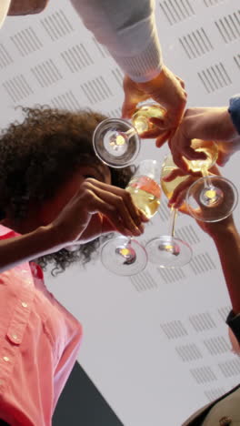businesspeople toasting glasses of champagne