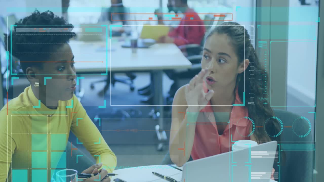 Animation of digital screen with data over diverse female coworkers in office