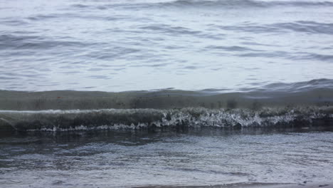 A-wave-slowly-coming-in-to-shore-on-the-lakefront