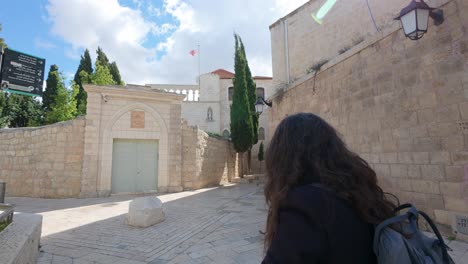 tourist explores the ancient streets of jerusalem holy city. slow motion.