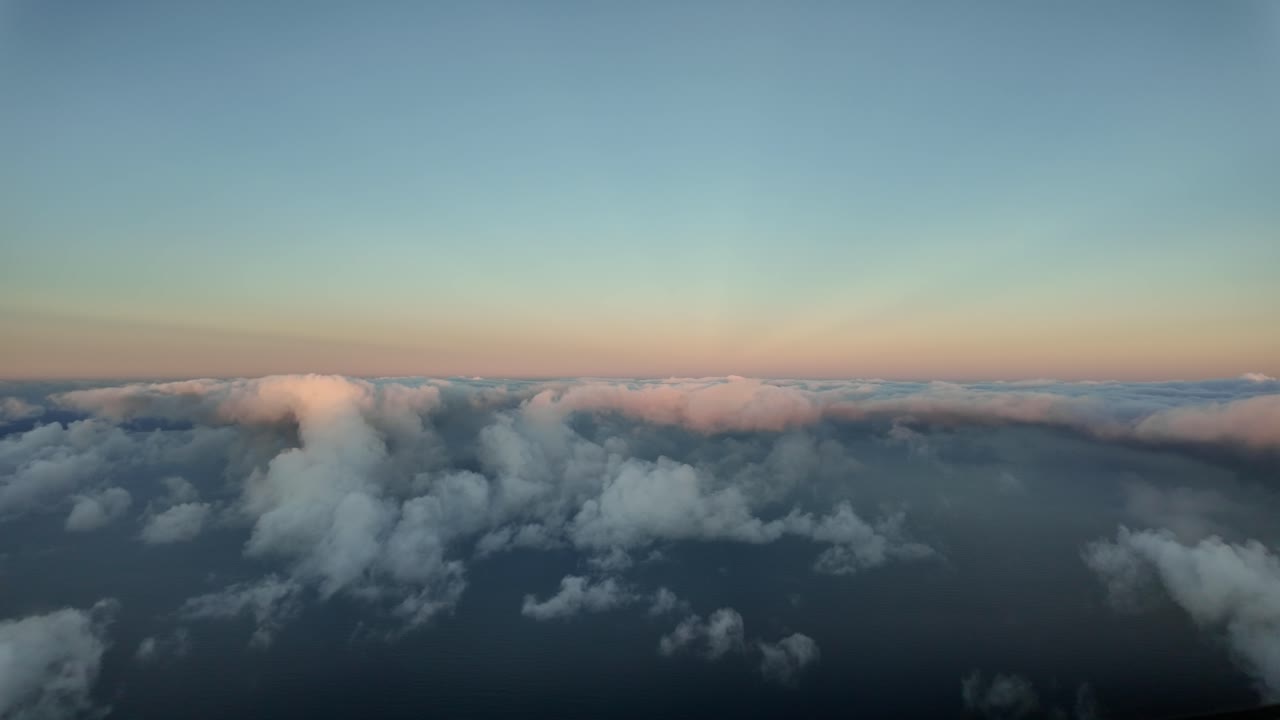 Flying through a quiet winter sky at sunset, as seen by the pilots in a real time flight over Mallorca Island, Spain