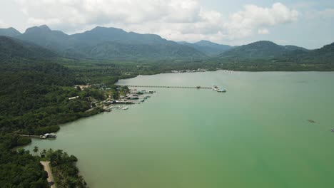 Aerial-drone-of-Salek-Phet-fishing-village-in-Koh-Chang-mountains-and-ocean